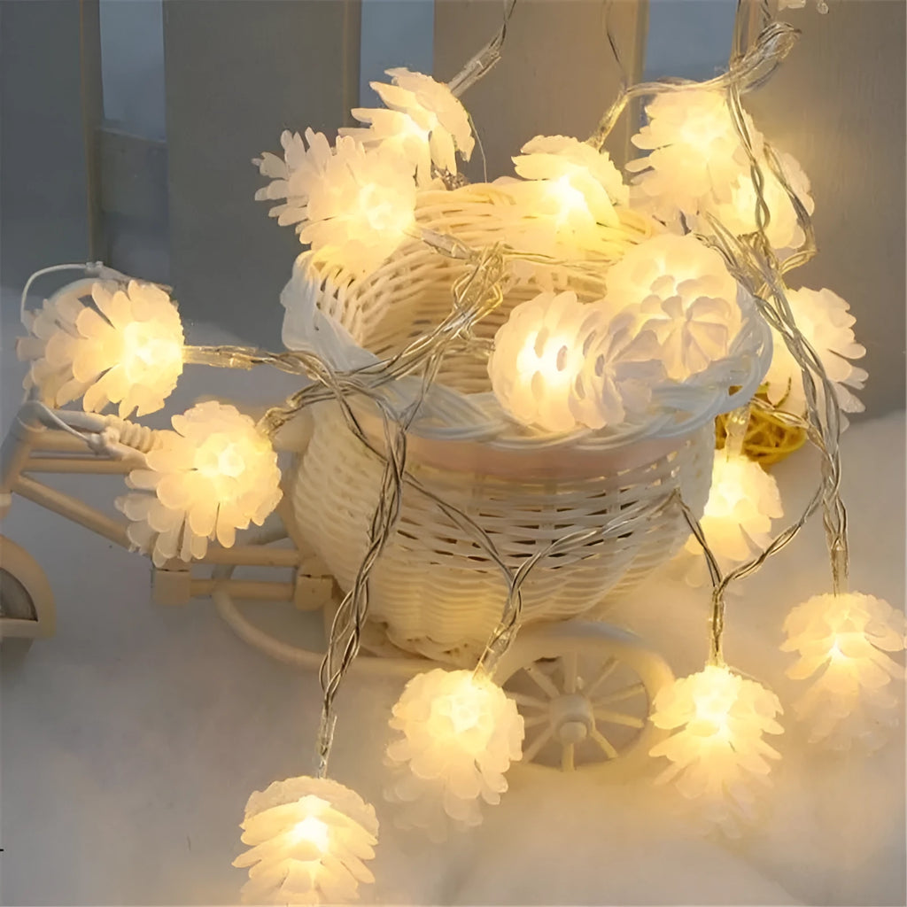 Warm white LED pine cone string lights with plastic shells in battery-powered decorative lighting