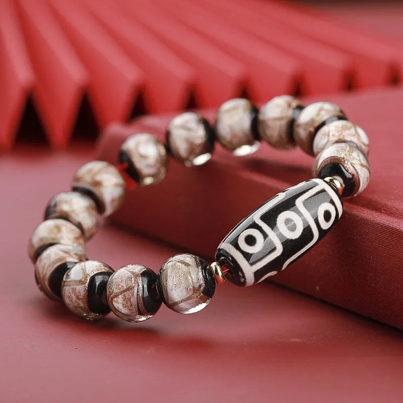 Handmade coloured glaze bracelet with auspicious patterns and year snake motif in Chinese style
