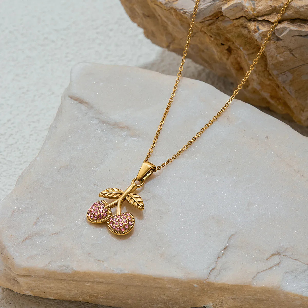 Titanium steel geometric pendant necklace with 18K gold-tone stainless steel blade chain on woman neck