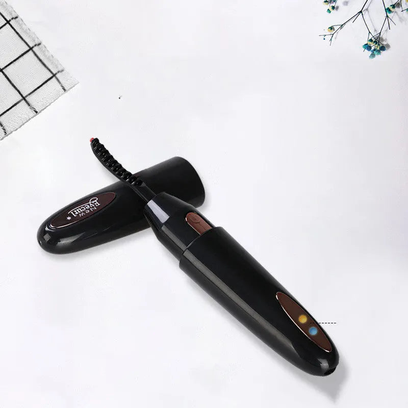 Electric rechargeable eyelash curler in black with silicone pad and temperature button