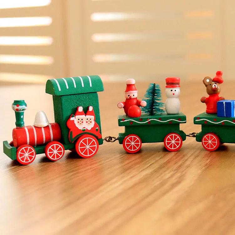 Four mini wood train cars in red, white, and green paint linked together on a shelf
