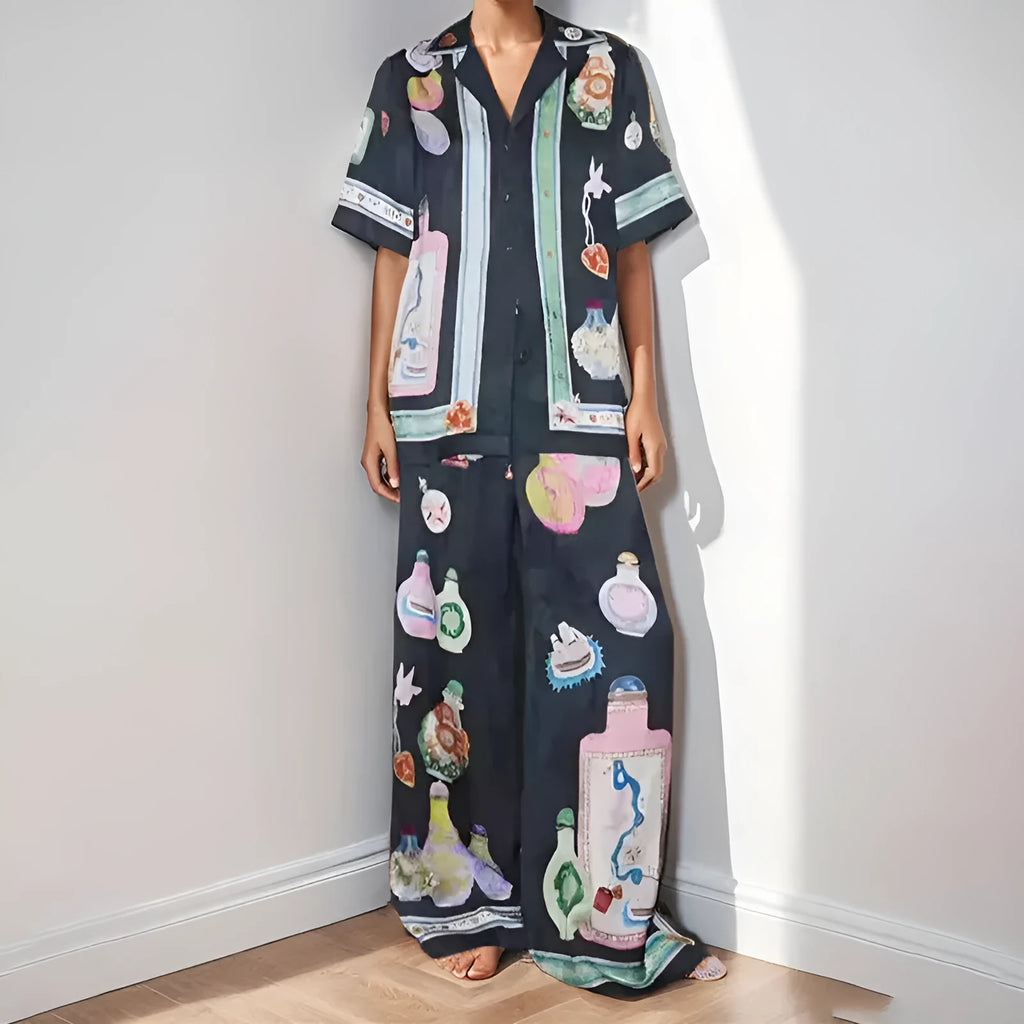 Black women's casual set with cartoon print, featuring a cardigan and matching trousers.
