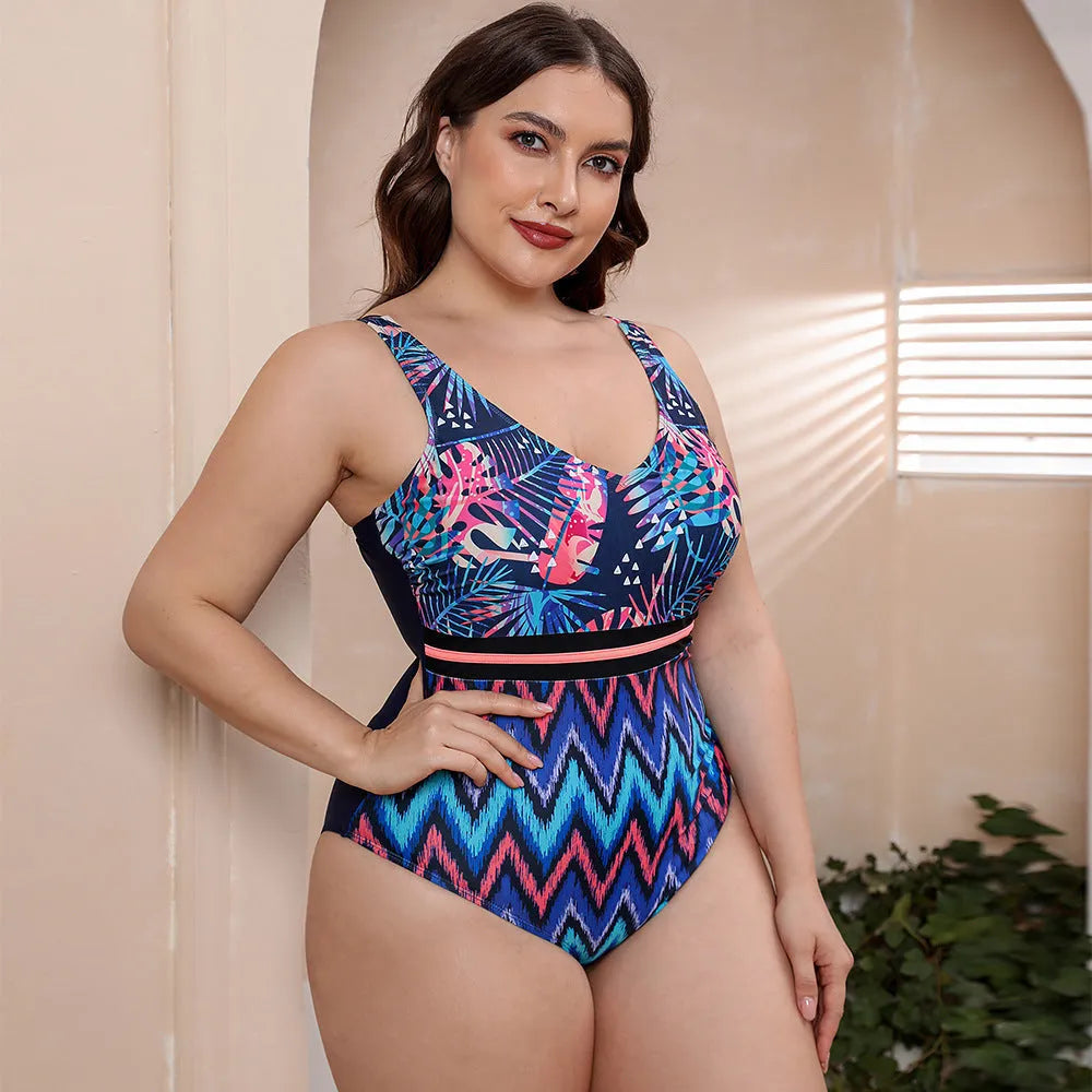 Blue printed stripe women's one-piece swimsuit with spaghetti straps on a mannequin.
