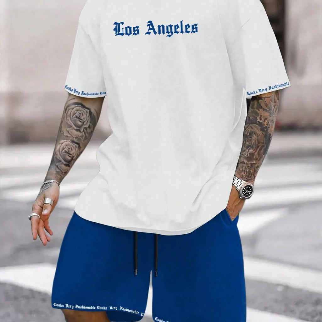 Men's blue printed short-sleeve top and matching shorts sports suit on a hanger.