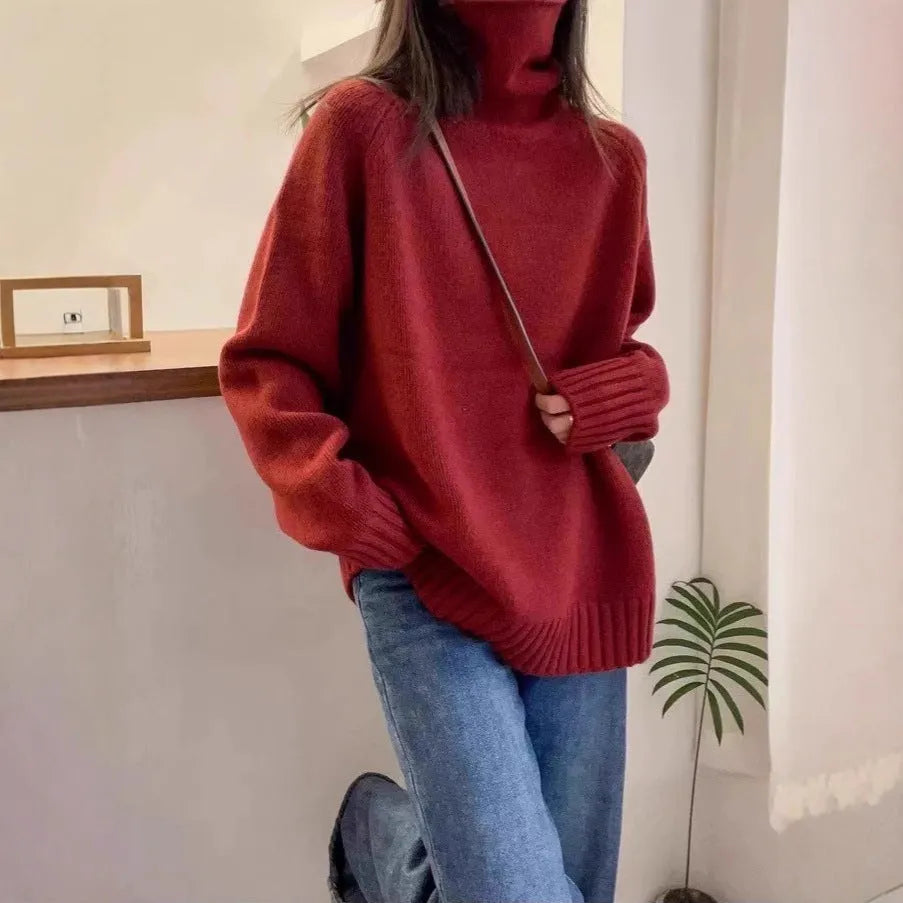 Women's loose turtleneck sweater with a thick curling pile collar in a solid colour