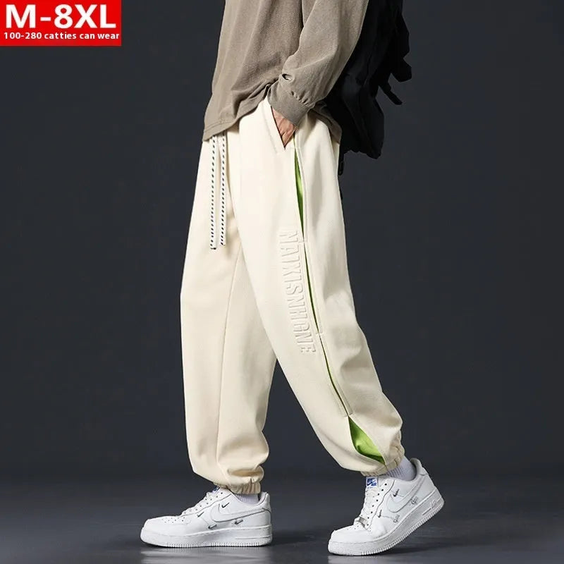 Men's black banded ankle cotton trousers with stitching detail and loose fit design