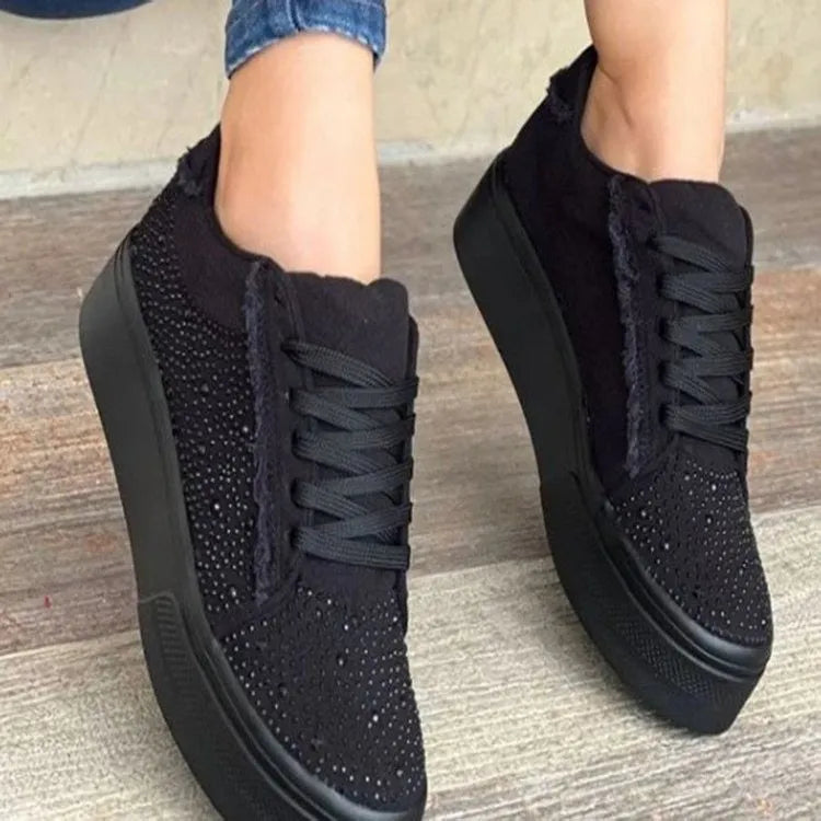Plus size women's black lace-up casual shoes with rhinestone detail on the round toe and a thick rubber sole.