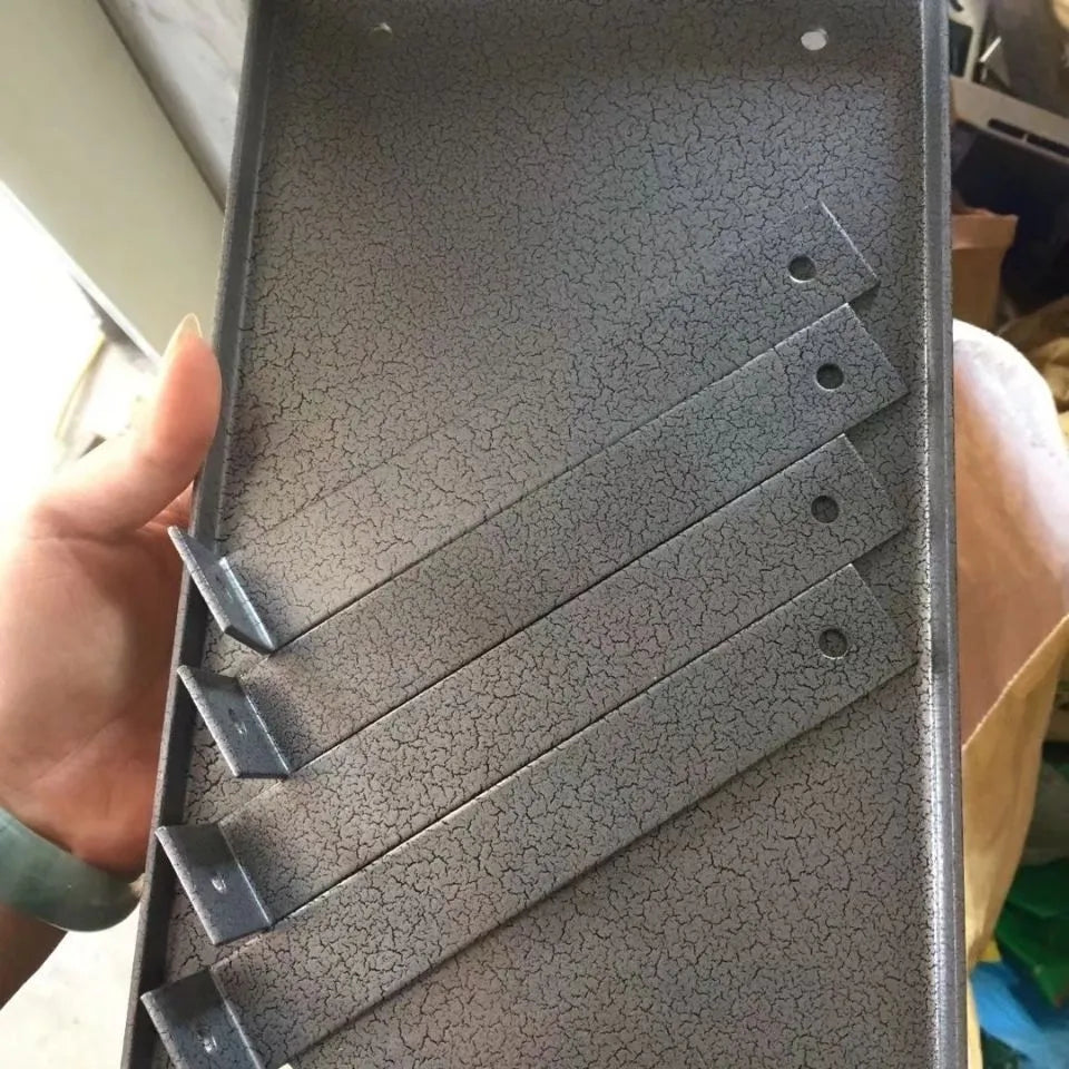 Black iron flip chip mounting bracket accessory for a portable electric planer.