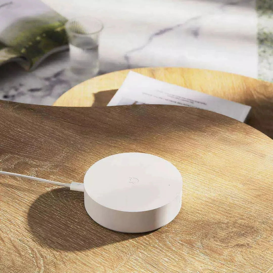 White Xiaomijia circular smart home gateway with UK plug for wall mounting