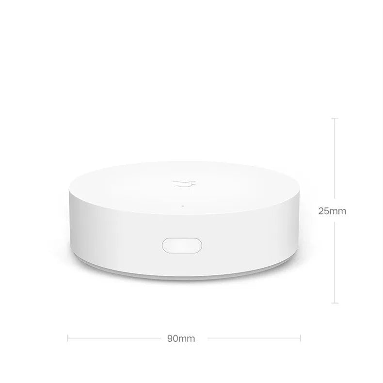 White Xiaomijia circular smart home gateway with UK plug for wall mounting