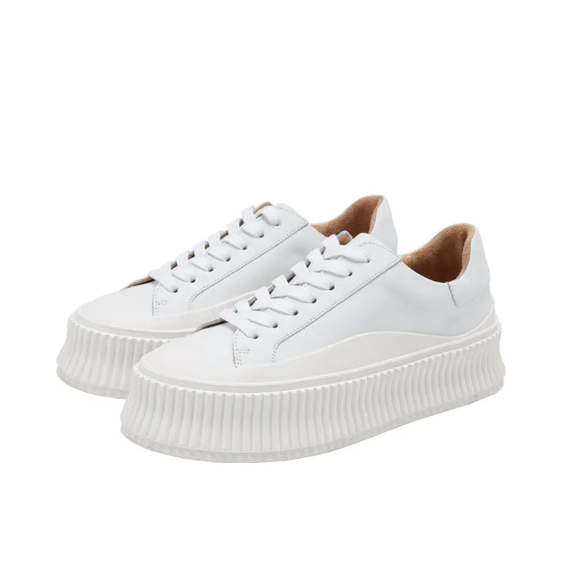 Women's white platform trainers with thick sole and back lacing on cowhide suede leather