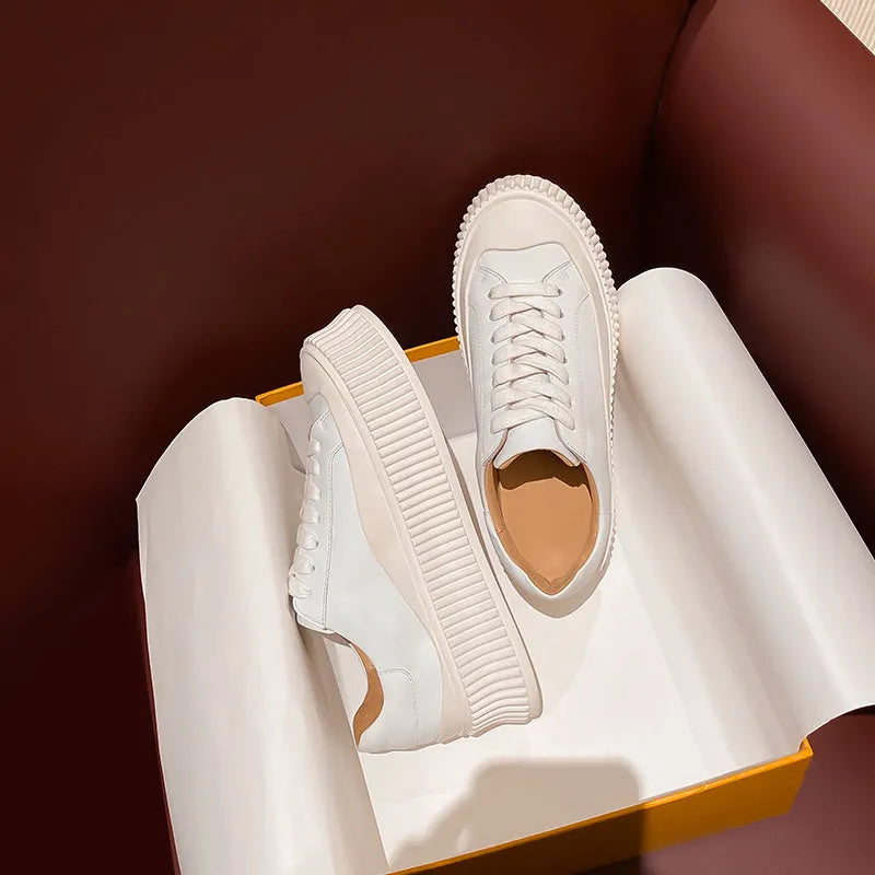 Women's white platform trainers with thick sole and back lacing on cowhide suede leather