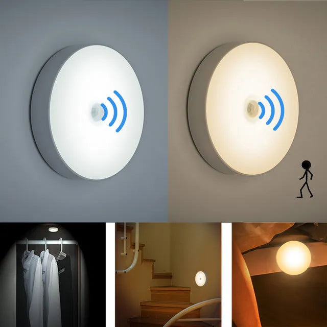 Small circular white motion sensing LED night light with USB charging cable and adhesive tape.