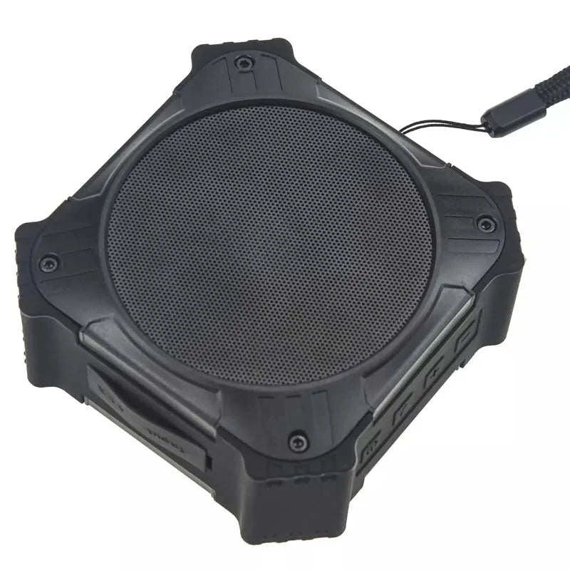 Compact circular waterproof Bluetooth speaker in black or blue with wrist strap for outdoor use