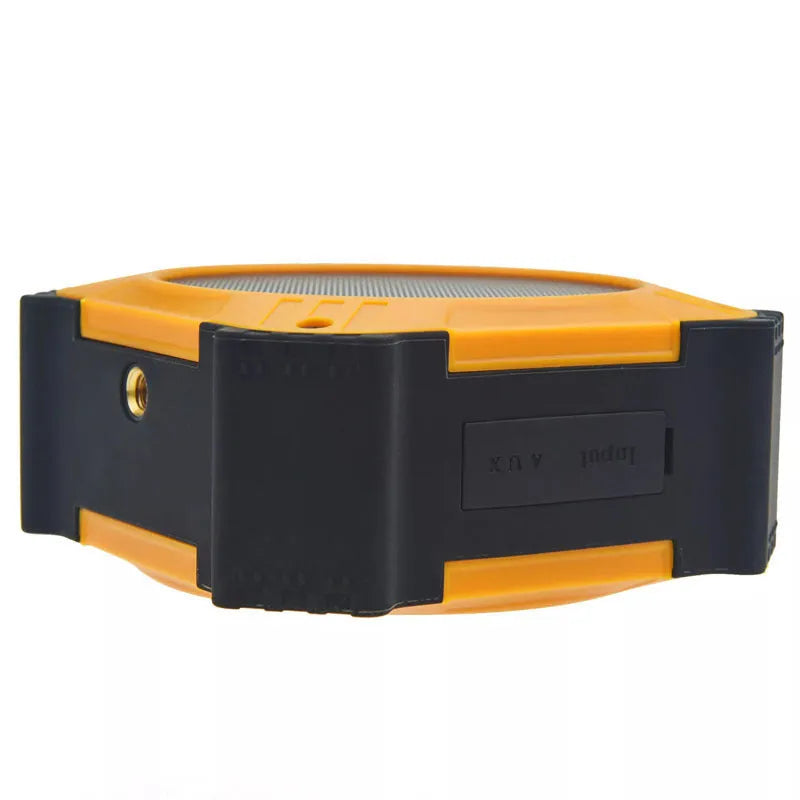 Compact circular waterproof Bluetooth speaker in black or blue with wrist strap for outdoor use
