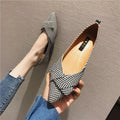 Women's black pointed toe low heel flat shoes with shallow mouth design and cotton upper.