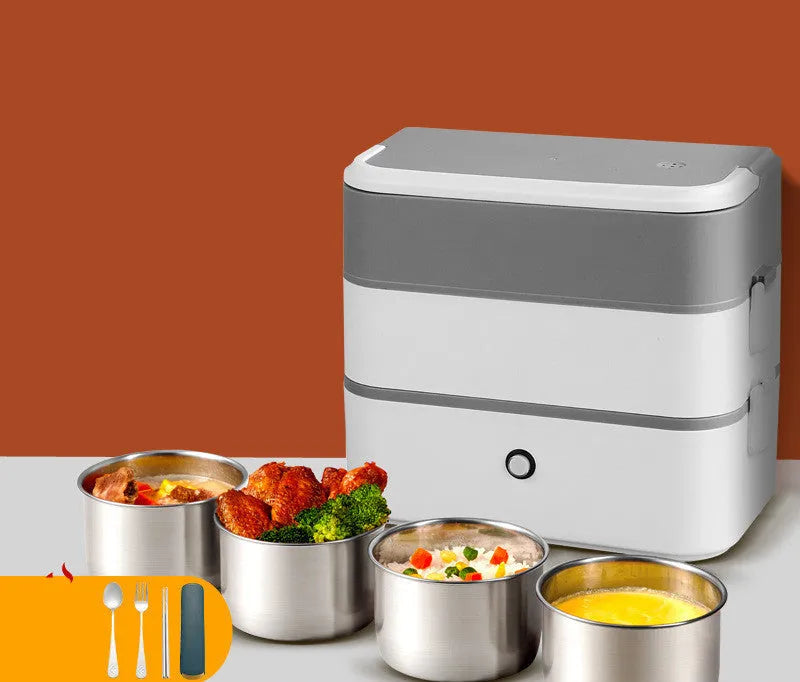 Double-layer portable heated lunch box with stainless steel liner showing push-button controls and power cord