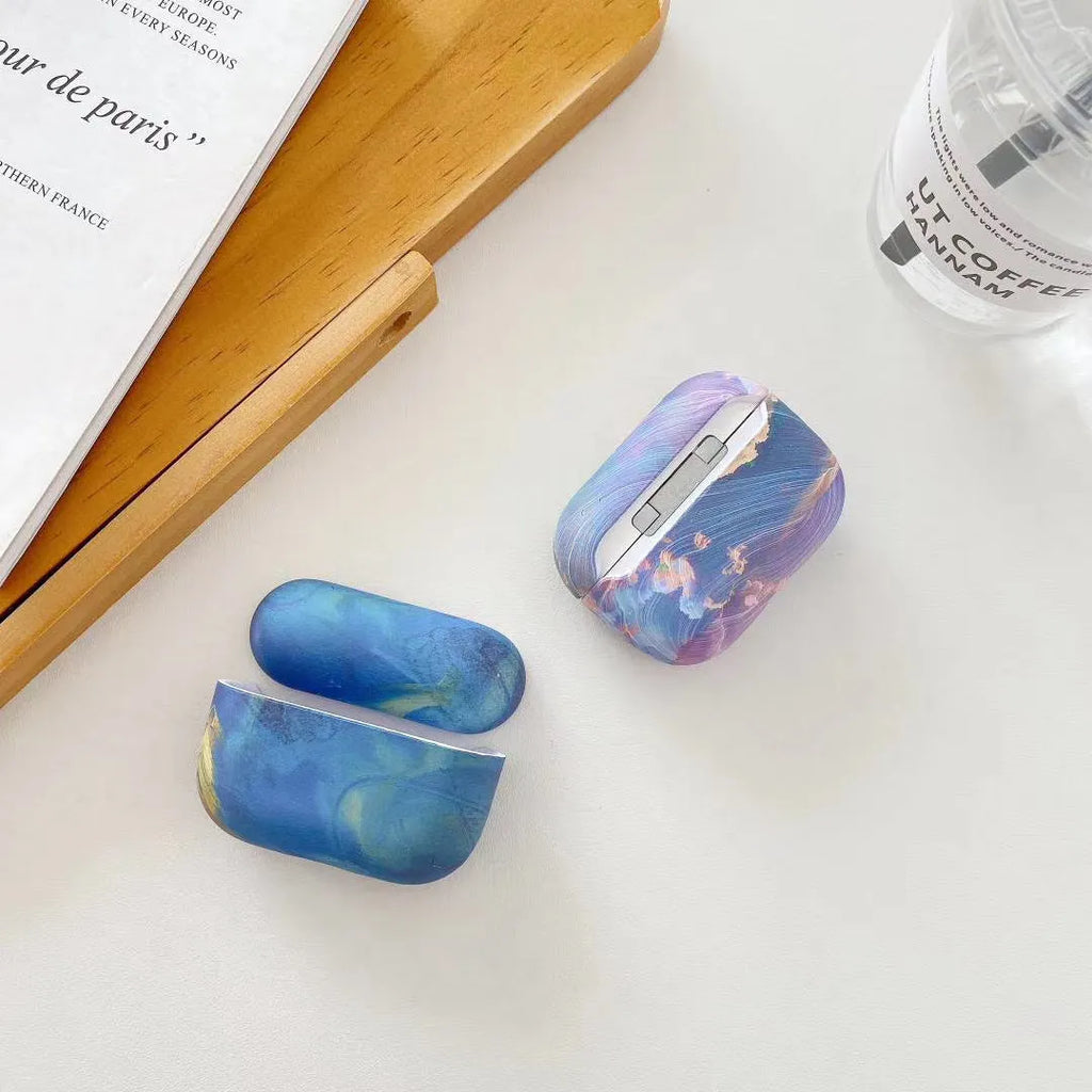 Pink and blue watercolour hard plastic protective cases for Apple AirPods 1, 2 and Pro earphones.