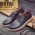 Men's black casual shoes with round toe and front-tie laces on a rubber sole