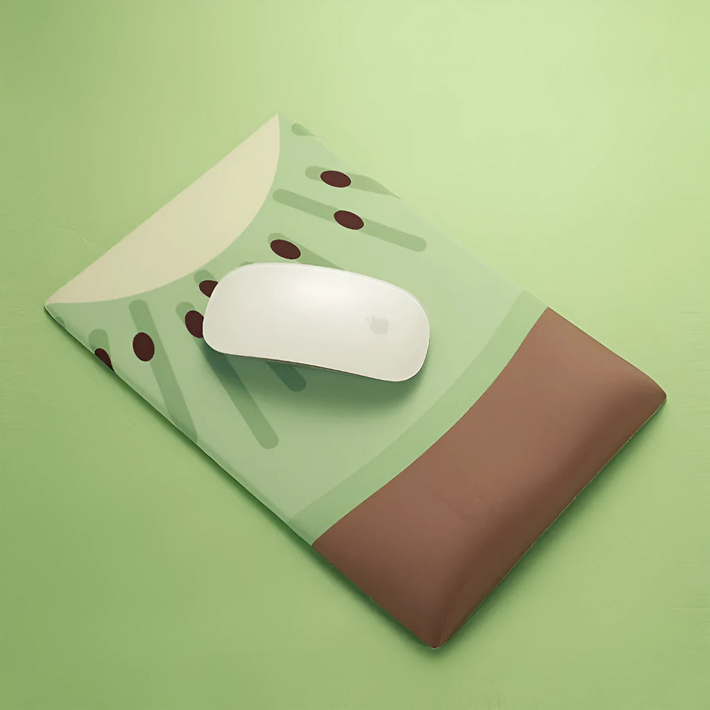 Kiwi fruit design silicone mouse pad with integrated thick wrist support cushion on a desk