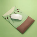 Kiwi fruit design silicone mouse pad with integrated thick wrist support cushion on a desk
