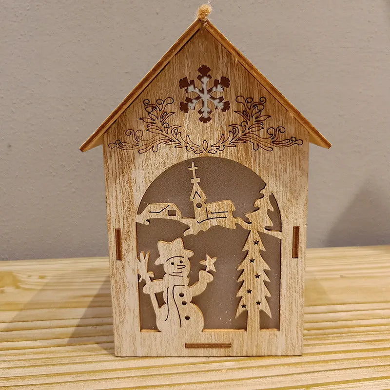 Set of three wooden Christmas house decorations with snowman and Santa figures in natural wood colour