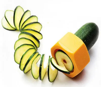 Yellow and green food-grade ABS plastic vegetable cutter with 8cm diameter on a kitchen worktop.