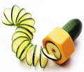 Yellow and green food-grade ABS plastic vegetable cutter with 8cm diameter on a kitchen worktop.