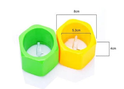 Yellow and green food-grade ABS plastic vegetable cutter with 8cm diameter on a kitchen worktop.