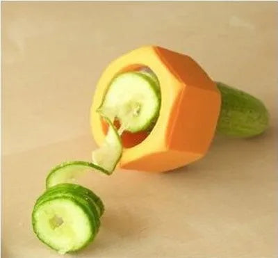 Yellow and green food-grade ABS plastic vegetable cutter with 8cm diameter on a kitchen worktop.