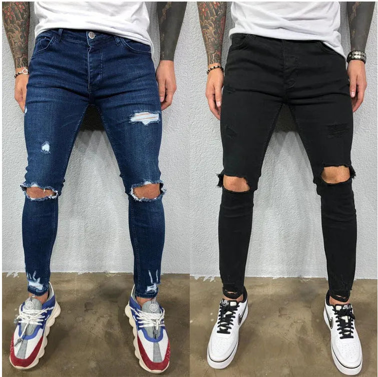 Men's skinny stretch denim jeans in black with ripped knee holes and tapered leg