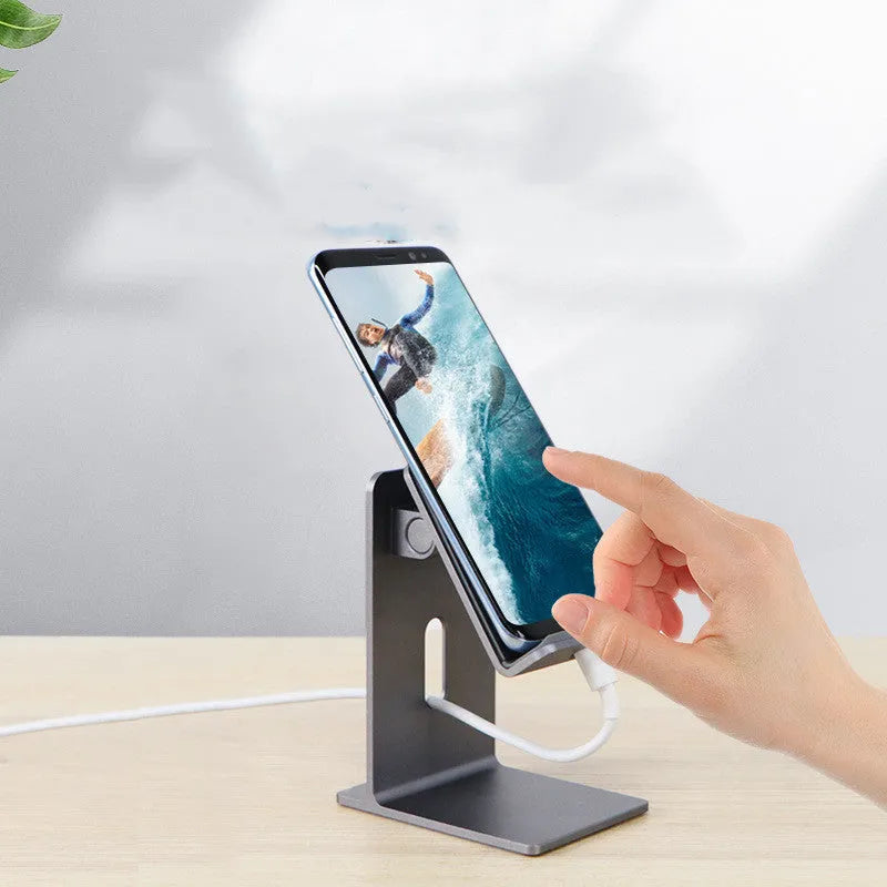 Dark space grey alloy lazy bracket mobile phone holder on a desktop