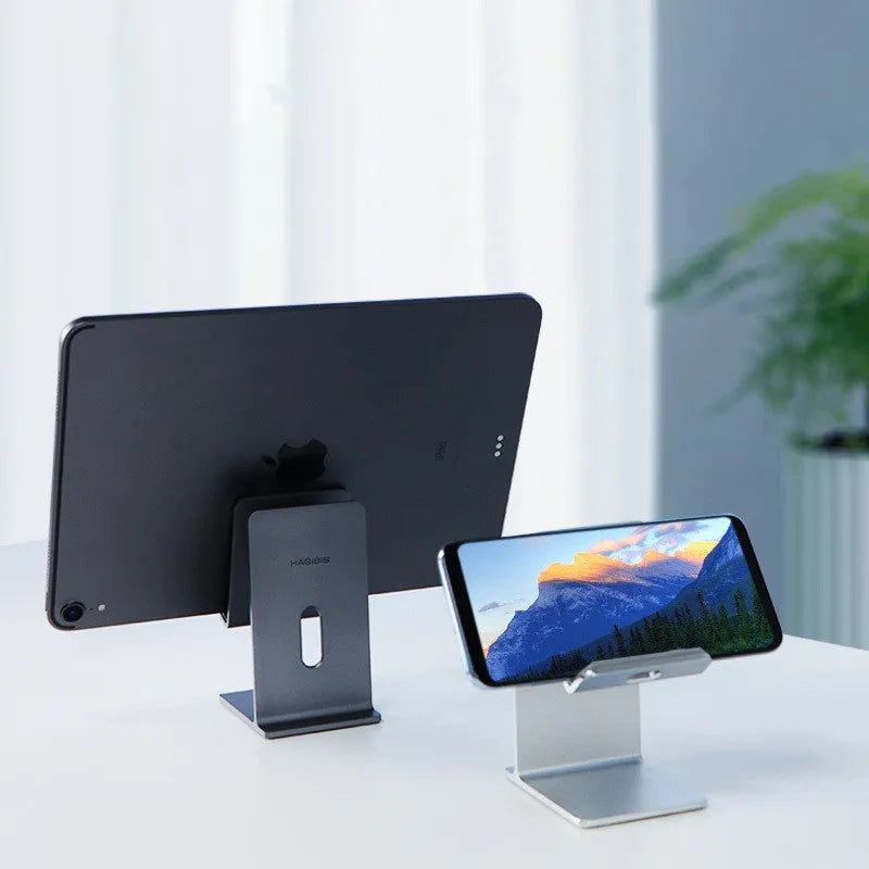 Dark space grey alloy lazy bracket mobile phone holder on a desktop