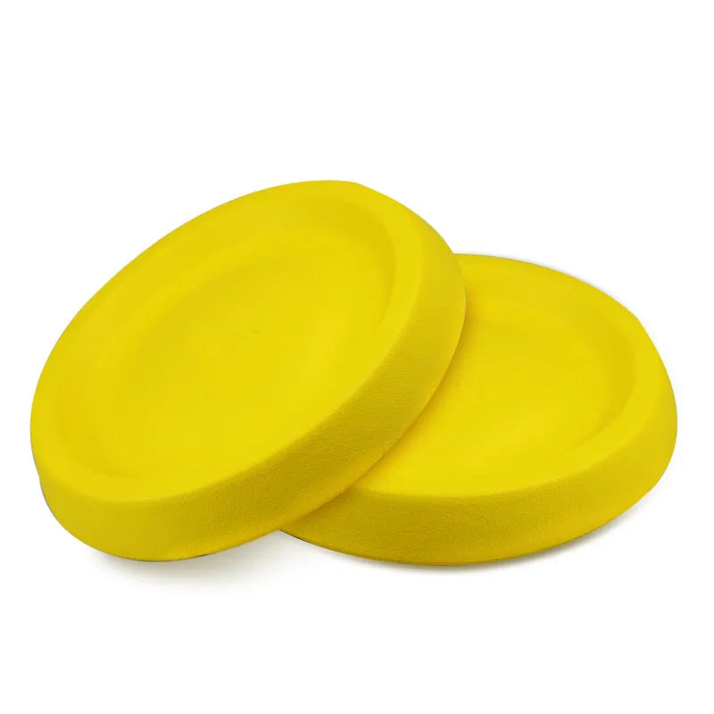 Bright yellow EVA dog throwing toy for training and play on grass