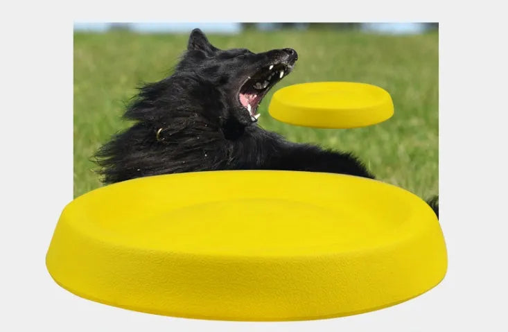 Bright yellow EVA dog throwing toy for training and play on grass