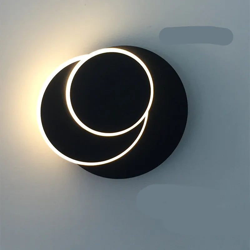 Modern round LED wall lamp in black or white with push button switch