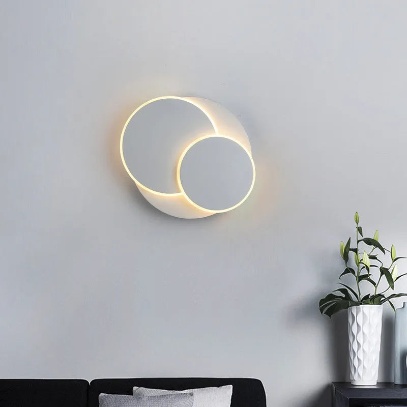 Modern round LED wall lamp in black or white with push button switch