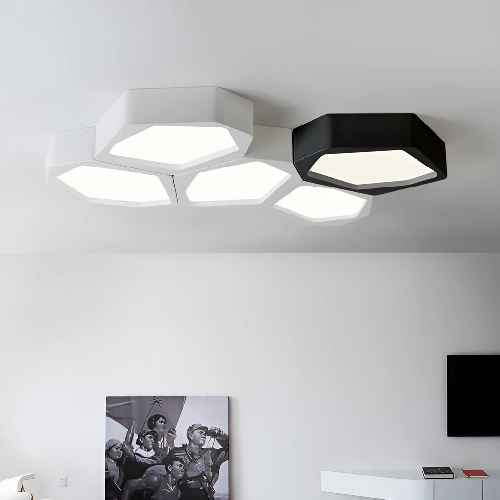 Black and white geometric shaped iron LED ceiling light on a ceiling, showing its special shape and modern design.