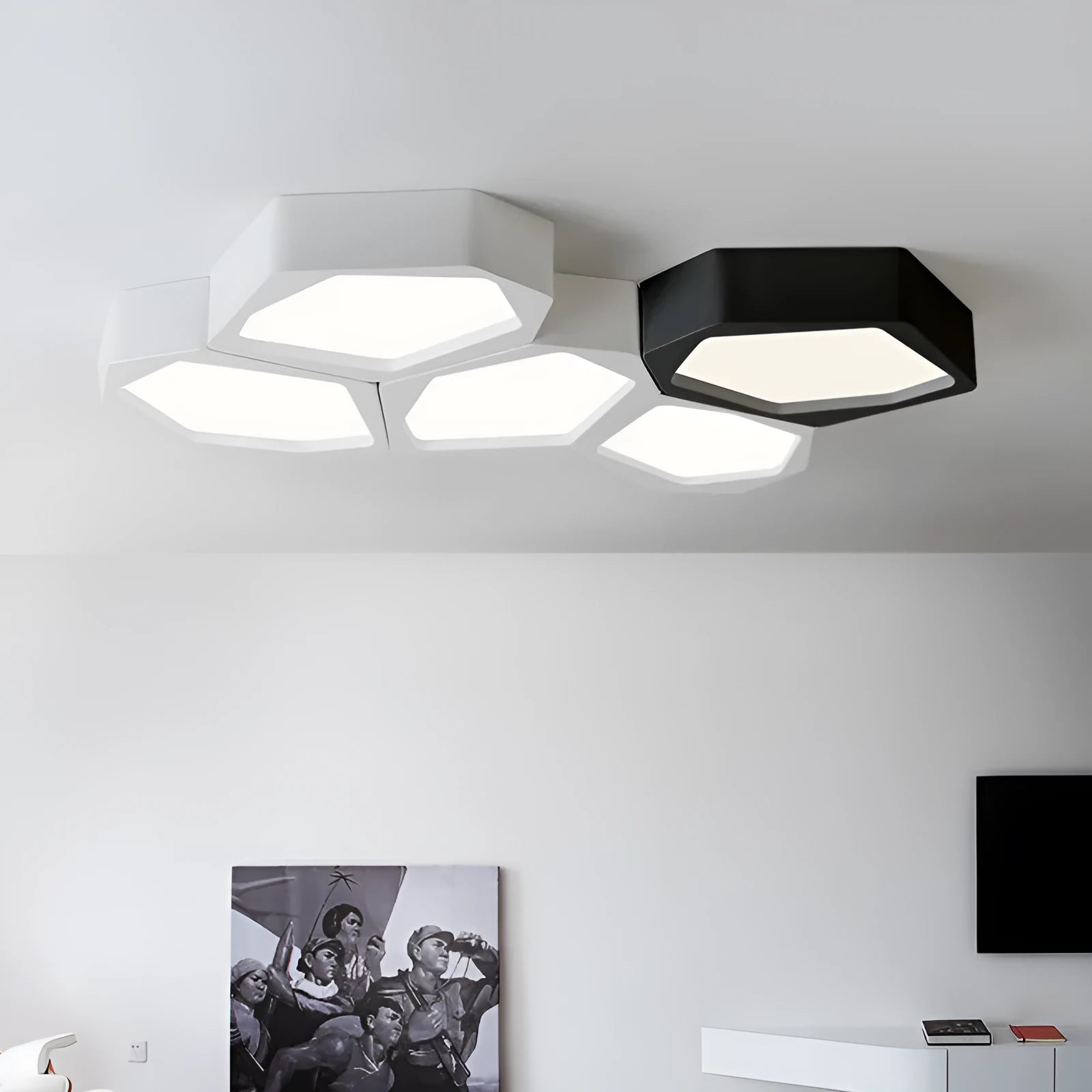 Black and white geometric shaped iron LED ceiling light on a ceiling, showing its special shape and modern design.