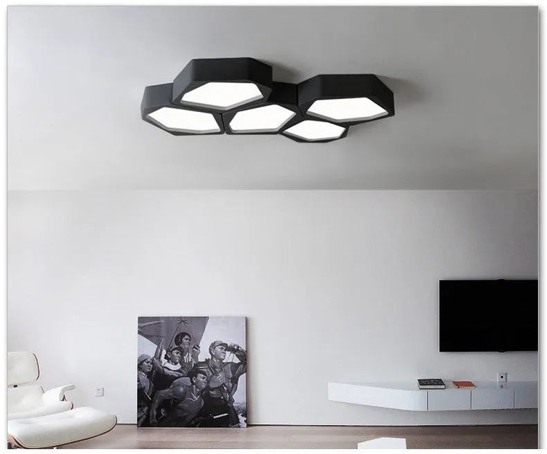 Black and white geometric shaped iron LED ceiling light on a ceiling, showing its special shape and modern design.