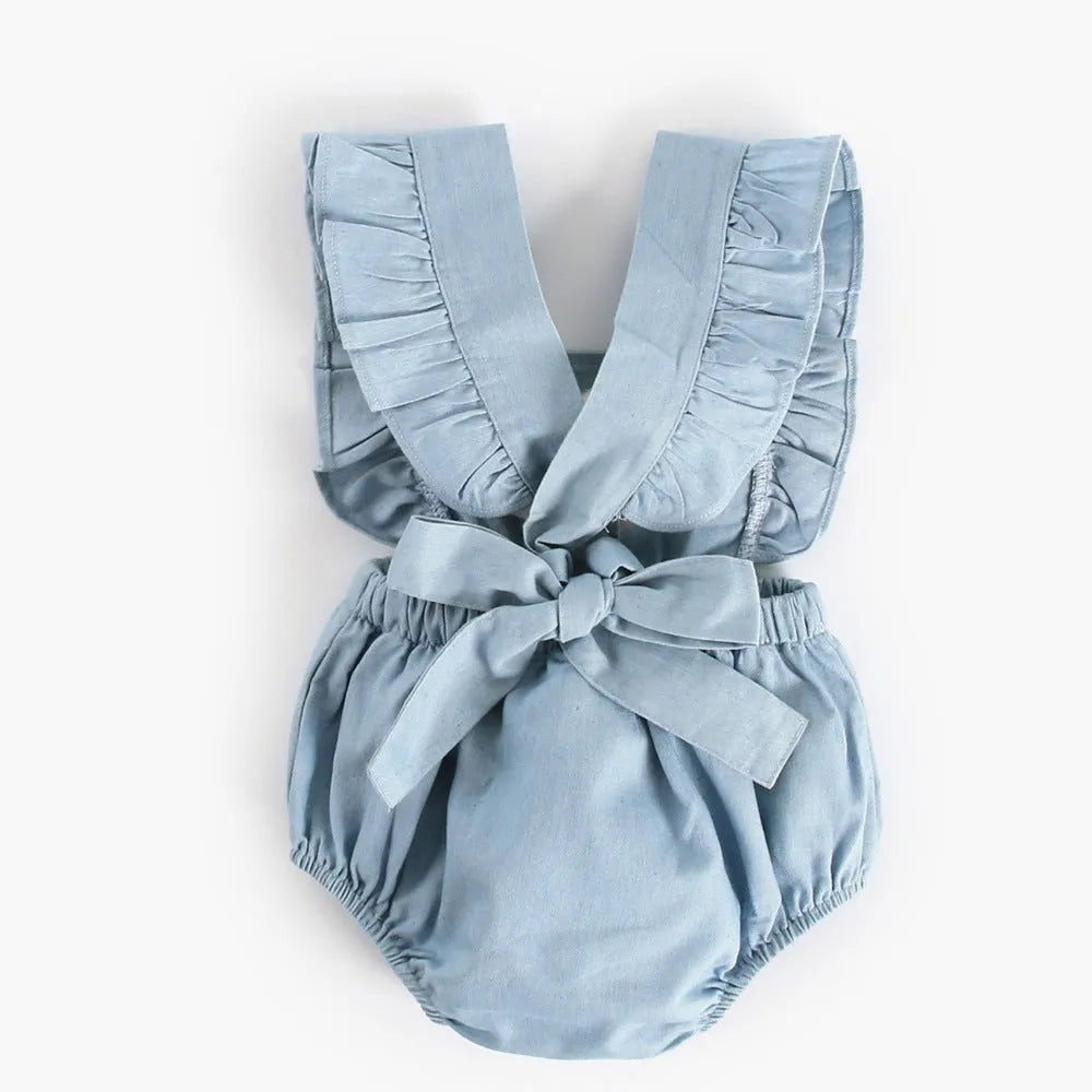 Blue denim baby one-piece bodysuit romper sleeveless with lace trim on white background
