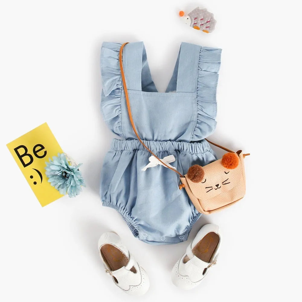 Blue denim baby one-piece bodysuit romper sleeveless with lace trim on white background