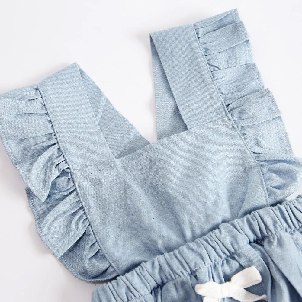 Blue denim baby one-piece bodysuit romper sleeveless with lace trim on white background