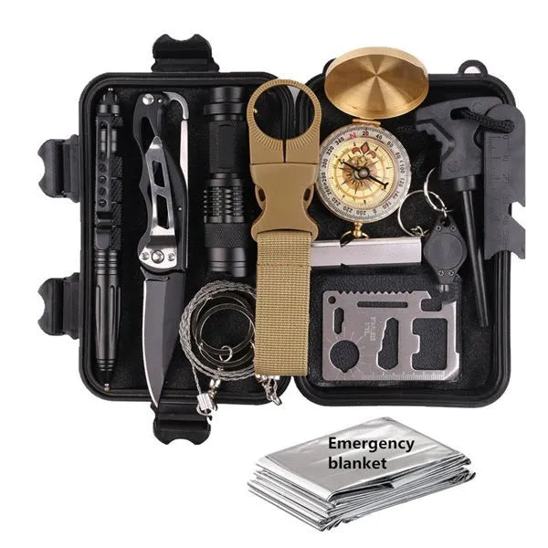 13-piece black outdoor survival tool set displayed with shockproof case open, showing compass, flashlight, saber, and blanket.