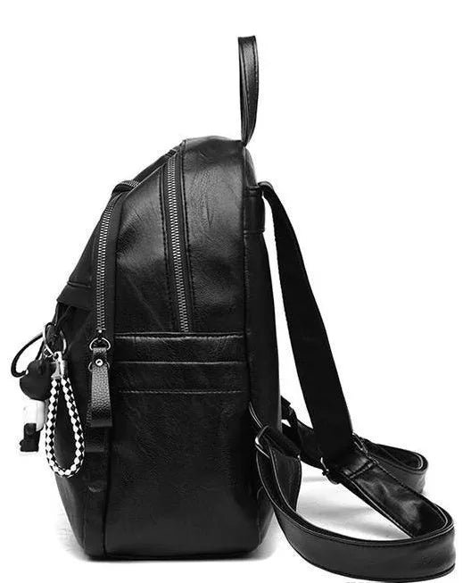 Black PU leather student backpack with double straps showing medium size and zipper opening