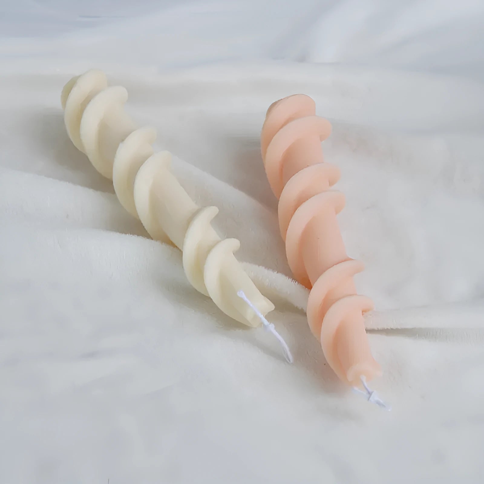 Silicone candle mould for making spiral lace rod decorative pillar candles.