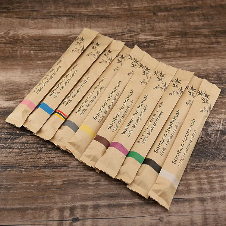 Set of 10 colourful bamboo toothbrushes with charcoal bristles for sustainable dental care