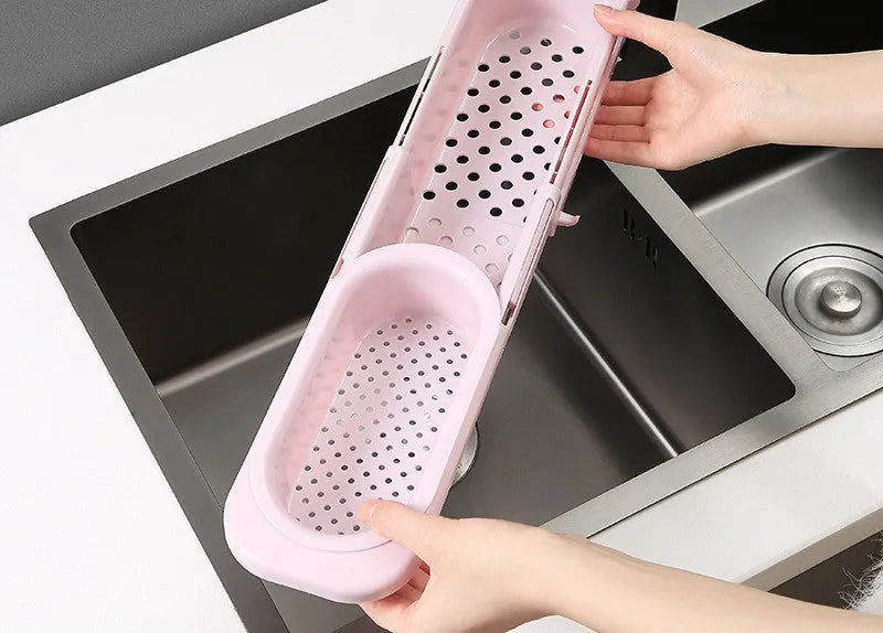 Adjustable telescopic sink rack organiser with drainage basket in kitchen sink