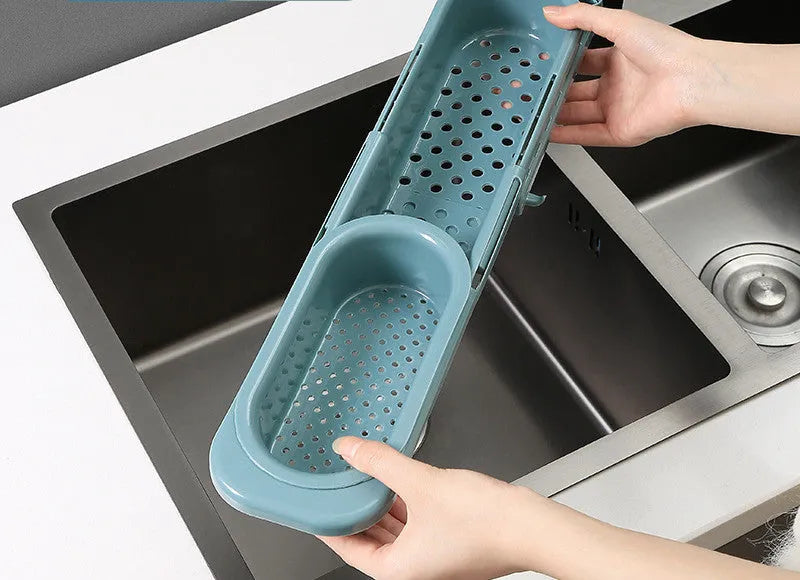 Adjustable telescopic sink rack organiser with drainage basket in kitchen sink