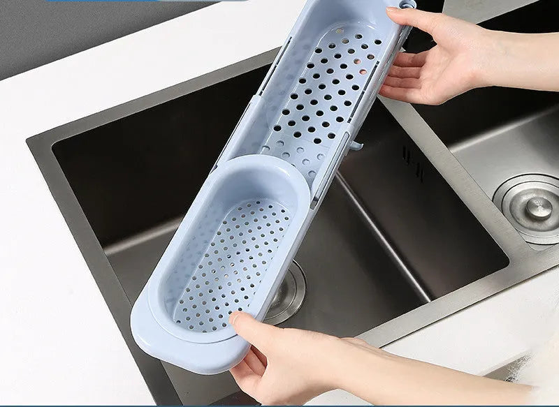 Adjustable telescopic sink rack organiser with drainage basket in kitchen sink